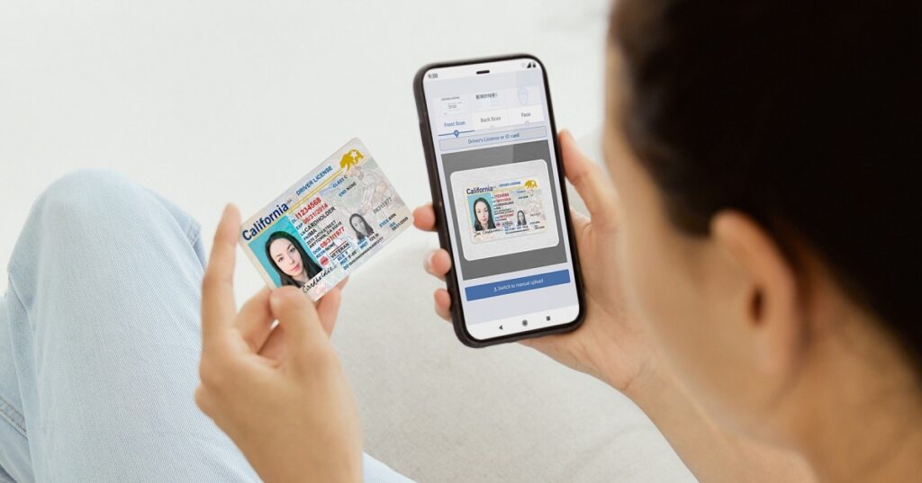 Person using cell phone to digitally verify identity as a service